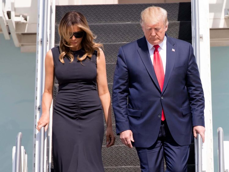 President Donald Trump and First Lady Melania Trump step off Air Force One at Wright-Patterson Air Force Base, Wednesday, Aug. 7, 2019, to visit Dayton, Ohio, following the mass shooting that left nine dead and 27 injured early Sunday morning. 

Trump Dayton 78