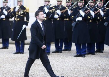 Ukrainian President Volodymyr Zelenskiy arrives to the Elysee Palace, Monday, Dec. 9, 2019 in Paris. The leaders of Russia, Ukraine, Germany and France meet to try to seek a settlement for the five-year conflict in eastern Ukraine that has killed 13,000 people. (AP Photo/Rafael Yaghobzadeh)