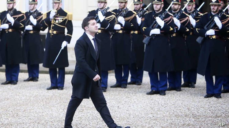 Ukrainian President Volodymyr Zelenskiy arrives to the Elysee Palace, Monday, Dec. 9, 2019 in Paris. The leaders of Russia, Ukraine, Germany and France meet to try to seek a settlement for the five-year conflict in eastern Ukraine that has killed 13,000 people. (AP Photo/Rafael Yaghobzadeh)