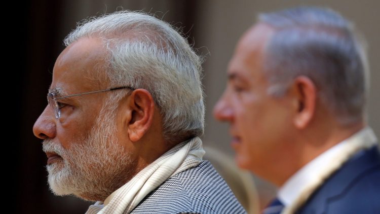 India's Prime Minister Narendra Modi and his Israeli counterpart Benjamin Netanyahu walk during their visit to Gandhi Ashram in Ahmedabad, India, January 17, 2018. REUTERS/Amit Dave - RC1CDFAC6A30