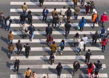 Aerial view of people on busy pedestrian crossing, Shanghai, China