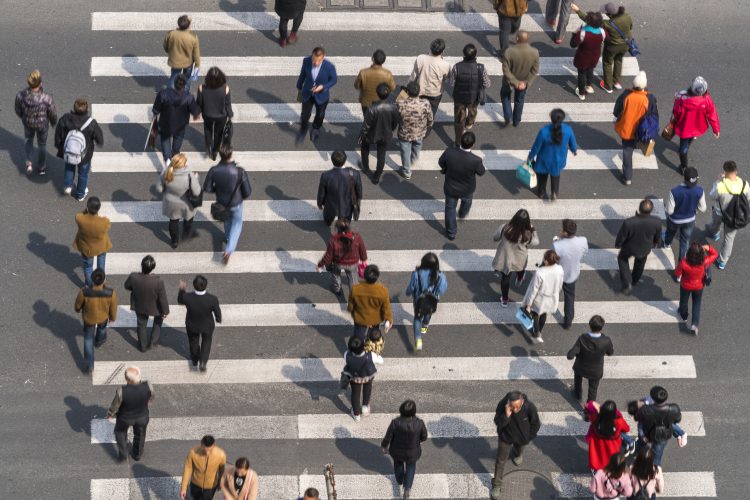 Aerial view of people on busy pedestrian crossing, Shanghai, China