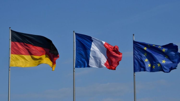 The German, French and European Union flags flutter in the wind at the Chancellery in Berlin on April 29, 2019 ahead of the West Balkans conference. - German Chancellor Angela Merkel and French President Emmanuel Macron are hosting the Western Balkans leaders and EU members Croatia and Slovenia hoping to reboot a dialogue between bitter foes Serbia and Kosovo over one of the Balkans' thorniest disputes. (Photo by John MACDOUGALL / AFP)