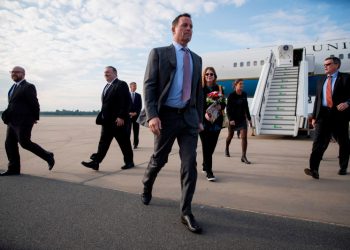 US ambassador to Germany Richard Grenell (C) walks to his vehicle after greeting US Secretary of State Mike Pompeo (2-L) at Tegel airport in Berlin on May 31, 2019. - The US top diplomat is on a European tour that will take him to Germany, Switzerland, The Netherlands and Britain. (Photo by Odd ANDERSEN / AFP)        (Photo credit should read ODD ANDERSEN/AFP via Getty Images)