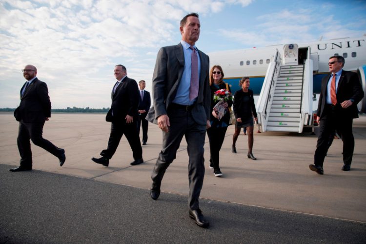 US ambassador to Germany Richard Grenell (C) walks to his vehicle after greeting US Secretary of State Mike Pompeo (2-L) at Tegel airport in Berlin on May 31, 2019. - The US top diplomat is on a European tour that will take him to Germany, Switzerland, The Netherlands and Britain. (Photo by Odd ANDERSEN / AFP)        (Photo credit should read ODD ANDERSEN/AFP via Getty Images)