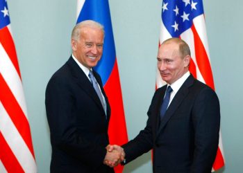 FILE - In this March 10, 2011, file photo, Vice President of the United States Joe Biden, left, shakes hands with Russian Prime Minister Vladimir Putin in Moscow, Russia. Putin won’t congratulate President-elect Joe Biden until legal challenges to the U.S. election are resolved and the result is official, the Kremlin announced Monday, Nov. 9, 2020. (AP Photo/Alexander Zemlianichenko, File)