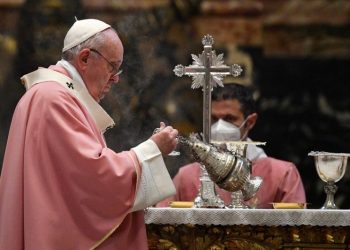 Pope Francis swings a thurible of incense around the altar at a mass to mark 500 years of Christianity in the Philippines, in St. Peter's Basilica at the Vatican, March 14, 2021. Tiziana Fabi/Pool via REUTERS