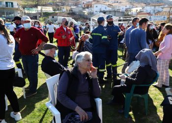 Local residents gather at a soccer field after an earthquake in Mesochori village, central Greece, Wednesday, March 3, 2021. An earthquake with a preliminary magnitude of up to 6.3 struck central Greece on Wednesday and was felt as far away as the capitals of neighboring Albania, North Macedonia, Kosovo and Montenegro. (AP Photo/Vaggelis Kousioras)