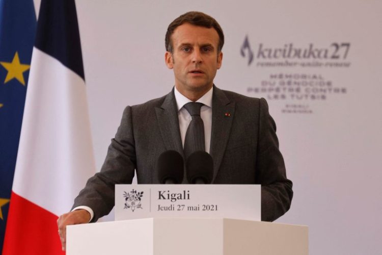 French President Emmanuel Macron delivers a speech during his visit to the Kigali Genocide Memorial, where some 250,000 victims of the massacres are buried, in Kigali on May 27, 2021. - French President Emmanuel Macron arrived in Rwanda on May 27, 2021, for a highly symbolic visit aimed at moving on from three decades of diplomatic tensions over France's role in the 1994 genocide in the country. Macron is the first French leader since 2010 to visit the East African nation, which has long accused France of complicity in the killing of some 800,000 mostly Tutsi Rwandans. (Photo by Ludovic MARIN / AFP) / RESTRICTED TO EDITORIAL USE - MANDATORY MENTION OF THE ARTIST UPON PUBLICATION - TO ILLUSTRATE THE EVENT AS SPECIFIED IN THE CAPTION