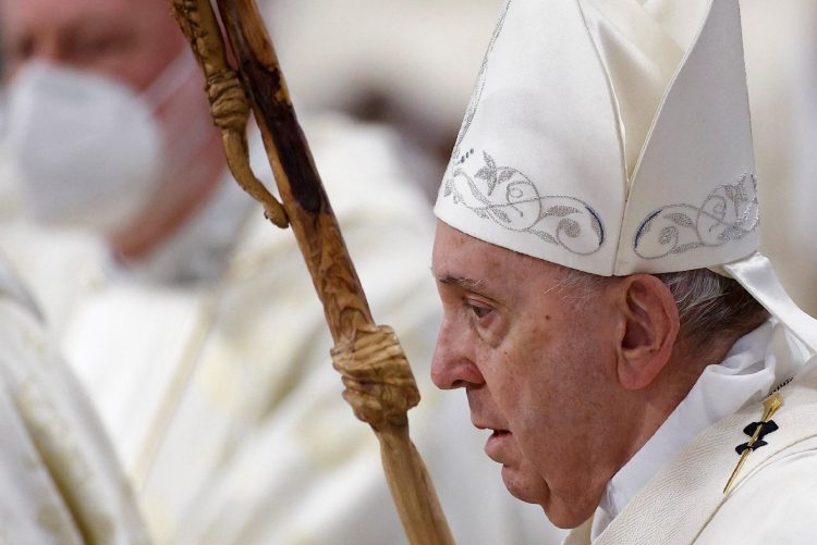 Pope Francis arrives to celebrate Mass marking the feast of Mary, Mother of God, in St. Peter's Basilica at the Vatican Jan. 1, 2022. (CNS photo/Guglielmo Mangiapane, Reuters)