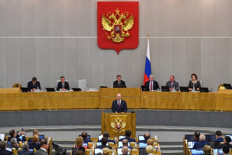 Russia's President Vladimir Putin and acting Prime Minister Dmitry Medvedev attend a session of the State Duma in Moscow on May 8, 2018.
Russia's lower house of parliament votes on Dmitry Medvedev's candidacy for the post of Prime Minister. / AFP PHOTO / Yuri KADOBNOV