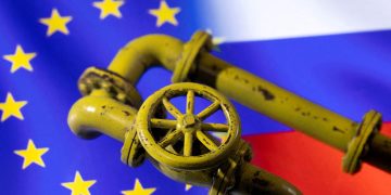 FILE PHOTO: A 3D printed Natural Gas Pipes are placed on displayed EU and Russian flags in this illustration taken, January 31, 2022. REUTERS/Dado Ruvic