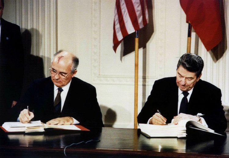 FILE PHOTO: Late U.S. President Ronald Reagan (R) and former Soviet leader Mikhail Gorbachev sign the Intermediate-Range Nuclear Forces (INF) treaty in the White House, December 8, 1987.