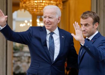 French President Emmanuel Macron (R) welcomes US President Joe Biden (L) before their meeting at the French Embassy to the Vatican in Rome on October 29, 2021. (Photo by Ludovic MARIN / AFP) (Photo by LUDOVIC MARIN/AFP via Getty Images)