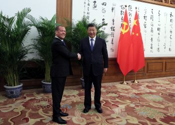 Deputy Chairman of Russia's Security Council Dmitry Medvedev and China's President Xi Jinping shake hands during a meeting in Beijing, China, December 21, 2022. Sputnik/Yekaterina Shtukina/Pool via REUTERS