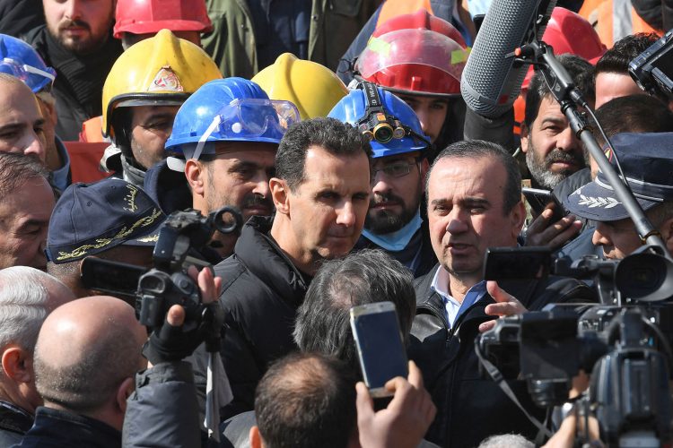 Syrian President Bashar al-Assad (C) visits neighbourhoods affected by an earthquake in the northern city of Aleppo, on February 10, 2023. - Almost 22,000 people are confirmed dead across Turkey and Syria in one of the worst disasters to hit the region in a around a century. More than 3,300 of them have been killed in Syria, according to health ministry figures and a rescue group. (Photo by AFP) (Photo by -/AFP via Getty Images)