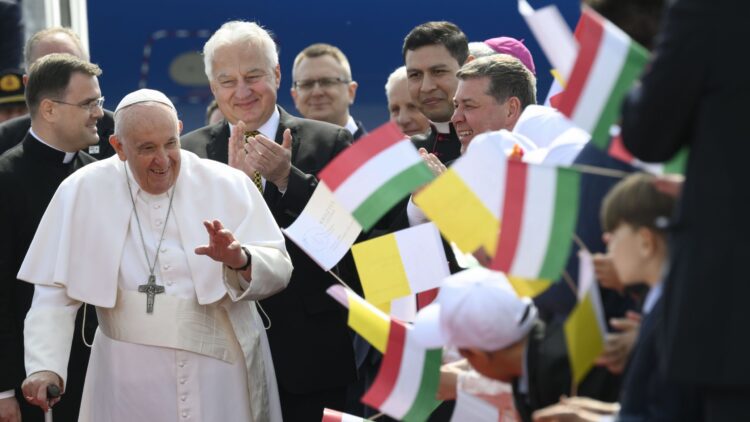 Pope Francis greets well-wishers as he arrives at the international airport in Budapest, Hungary, April 28, 2023. The pope was beginning a three-day trip to Hungary's capital. (CNS photo/Vatican Media)