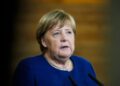 FILED - 22 November 2021, Berlin: Former German Chancellor Angela Merkel speaks to the media during her visit to the TUMO Learning Center. Merkel's memoirs, titled 'Freedom', to be published late November Photo: Markus Schreiber/AP-Pool/dpa