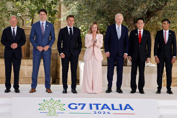 From left, German Chancellor Olaf Scholz, Canadian Prime Minister Justin Trudeau, French President Emmanuel Macron, Italy's Prime Minister Giorgia Meloni, US President Joe Biden, Japanese Prime Minister Fumio Kishida, British Prime Minister Rishi Sunak pose for a family photo at Borgo Egnazia resort during the G7 Summit hosted by Italy in Apulia region, on June 13, 2024 in Savelletri. Leaders of the G7 wealthy nations gather in southern Italy this week against the backdrop of global and political turmoil, with boosting support for Ukraine top of the agenda. (Photo by Ludovic MARIN / AFP) (Photo by LUDOVIC MARIN/AFP via Getty Images)