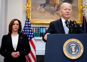 U.S. President Joe Biden speaks next to Vice President Kamala Harris as he delivers a statement a day after Republican challenger Donald Trump was shot at a campaign rally, during brief remarks at the White House in Washington, U.S., July 14, 2024. REUTERS/Nathan Howard