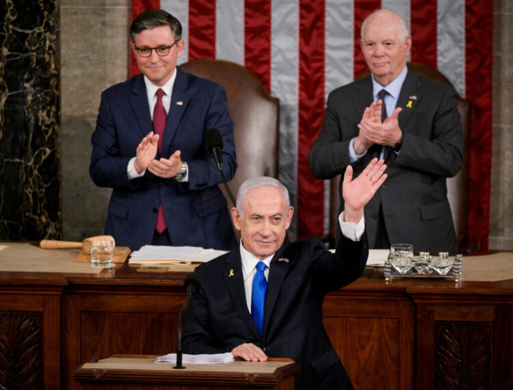 U.S. House Speaker Mike Johnson (R-LA) and Senate Foreign Relations Chair, Senator Ben Cardin (D-MD), applaud as Israeli Prime Minister Benjamin Netanyahu addresses a joint meeting of Congress at the U.S. Capitol in Washington, U.S., July 24, 2024. REUTERS/Craig Hudson