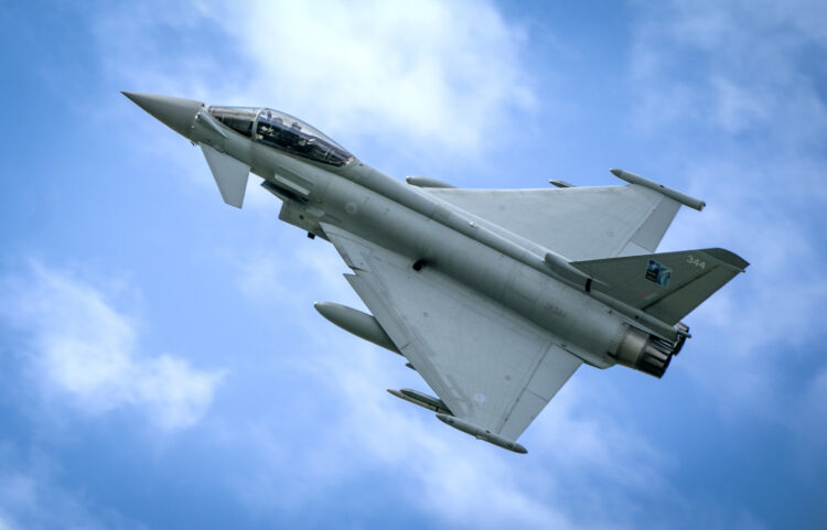 A Typhoon fighter jet in the skies above the Amari Airbase in Estonia. Here a squadron of RAF Typhoon jets are deployed on Operation Azotize the UK's commitment to NATO's Baltic Air policing mission. Picture date: Thursday July 27, 2023. PA Photo. This year's deployment began in March 2023. The RAF has conducted an annual NATO air policing mission since the NATO Warsaw Summit of 2014. See PA story DEFENCE Estonia. Photo credit should read: Jane Barlow/PA Wire