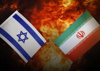 Flags of iran and Israel of america against the background of a fiery explosion. The concept of enmity and war between countries. Tense political relations.