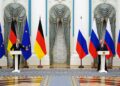 FILED - 15 February 2022, Russia, Moscow: Russian President Vladimir Putin (R) and German Chancellor Olaf Scholz speak during a press conference after their meeting at the Kremlin. Photo: Kay Nietfeld/dpa