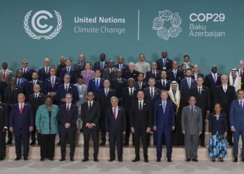 Barbados Prime Minister Mia Mottley, United Kingdom Prime Minister Keir Starmer, Simon Stiell, United Nations climate chief, Antonio Guterres, United Nations secretary-general, Ilham Aliyev, Azerbaijan president, and Turkey President Recep Tayyip, front center, pose with others for a group photo at the COP29 U.N. Climate Summit, Tuesday, Nov. 12, 2024, in Baku, Azerbaijan. (AP Photo/Peter Dejong)