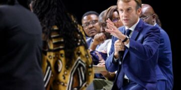 French President Emmanuel Macron speaks during the plenary session of the "Africa-France Summit" gathering some 3000 Africa continent entrepreneurs, artists or sporting figures in Montpellier, southern France, on October 8, 2021. - No Africa head of state has been invited to the summit, which is being held in a delicate context while the influence of France in its former precinct is increasingly disputed, particularly by Russia, and because Paris is in open crisis with two of its former colonies, Mali and Algeria. (Photo by Ludovic MARIN / AFP)