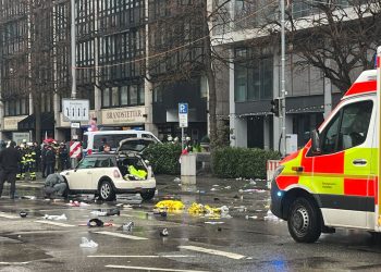 Police officers investigate a car near a crime scene in Munich city center, where a vehicle drove into a group of people. Photo: Christoph Trost/dpa