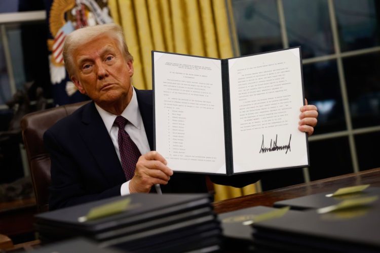 WASHINGTON, DC - JANUARY 20: President Donald Trump signs executive orders in the Oval Office on January 20, 2025 in Washington, DC.  Trump takes office for his second term as the 47th president of the United States. (Photo by Anna Moneymaker/Getty Images)