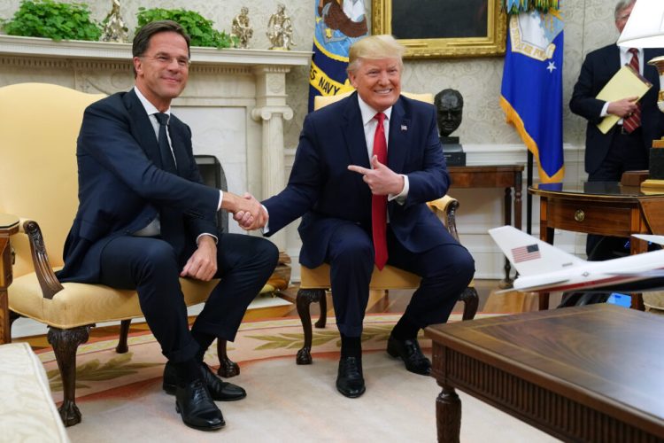 WASHINGTON, DC - JULY 18: U.S. President Donald Trump (R) and Dutch Prime Minister Mark Rutte pose for photographs after talking to reporters in the Oval Office at the White House July 18, 2019 in Washington, DC. According to the Dutch government, the two leaders will discuss defense and security cooperation, especially focused on whether the Netherlands will participate in a global effort to secure international waterways against threats from Iran. (Photo by Chip Somodevilla/Getty Images)